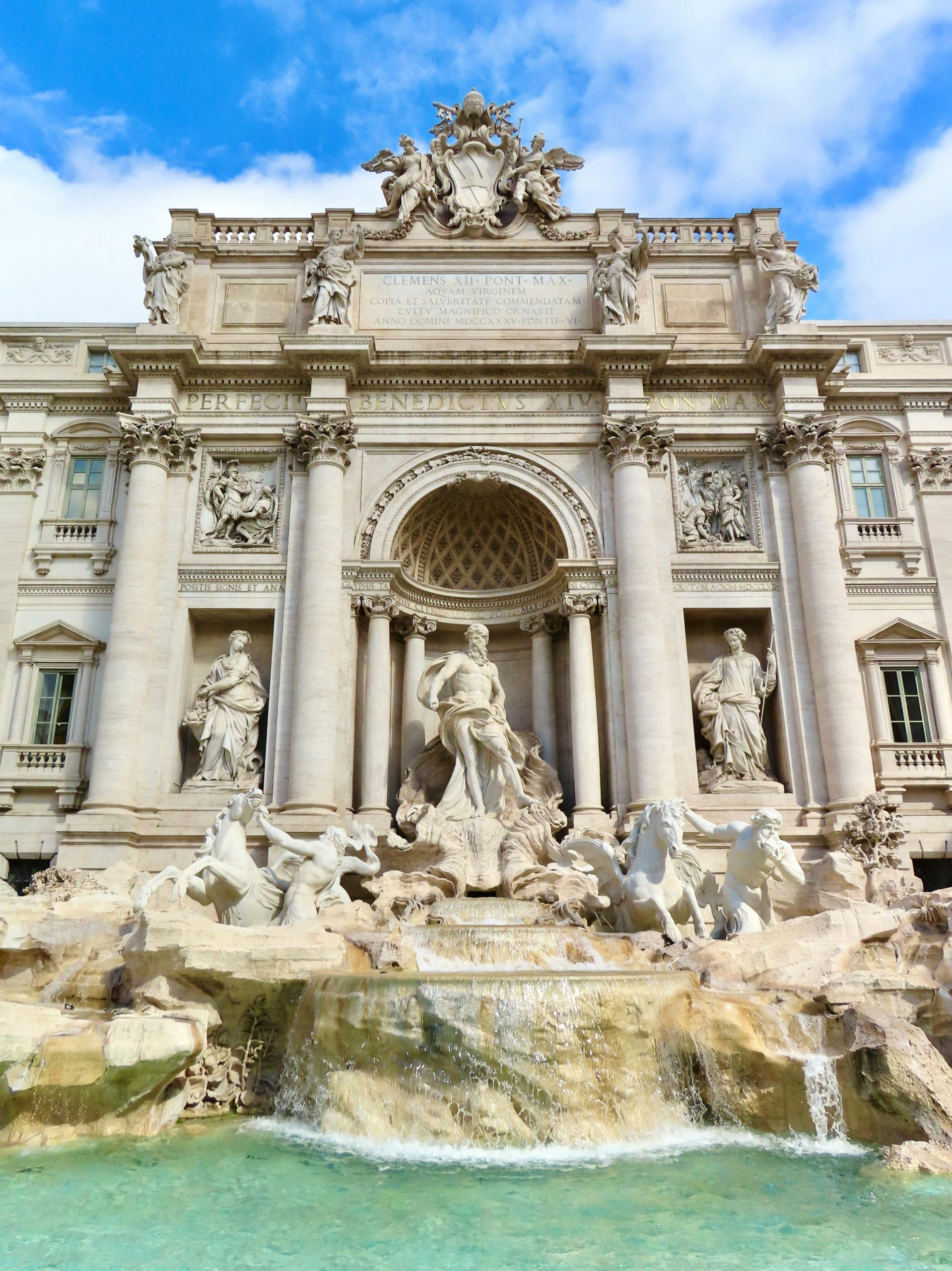 services-02 Stunning baroque Trevi Fountain in Rome, showcasing intricate sculptures and architectural detail.